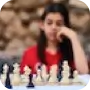 girl looking at chess board